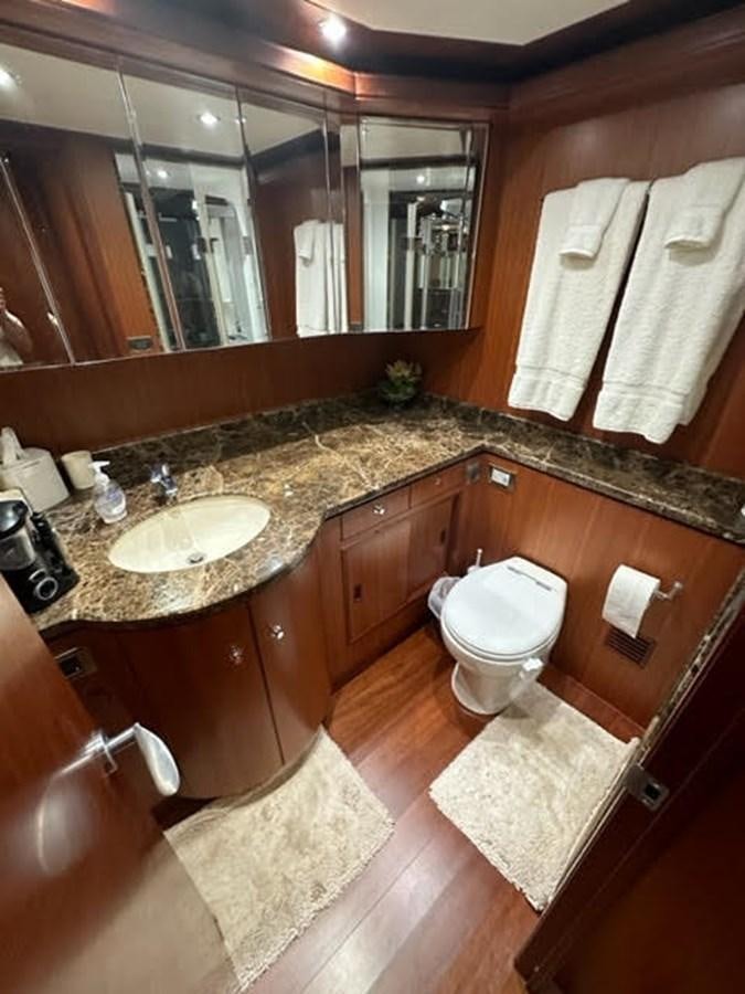 a bathroom with a sink and toilet aboard ISLAND GIRL Yacht for Sale