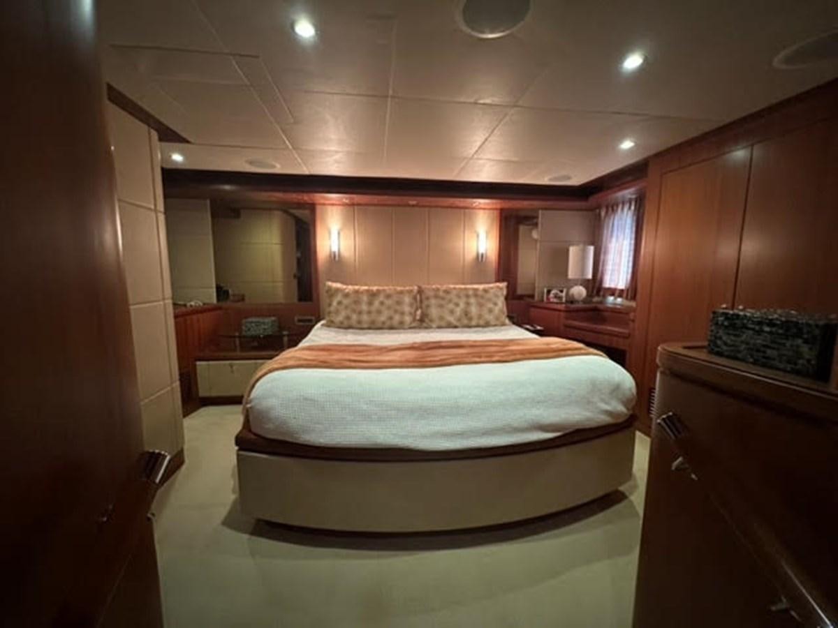 a bedroom with a bed aboard ISLAND GIRL Yacht for Sale