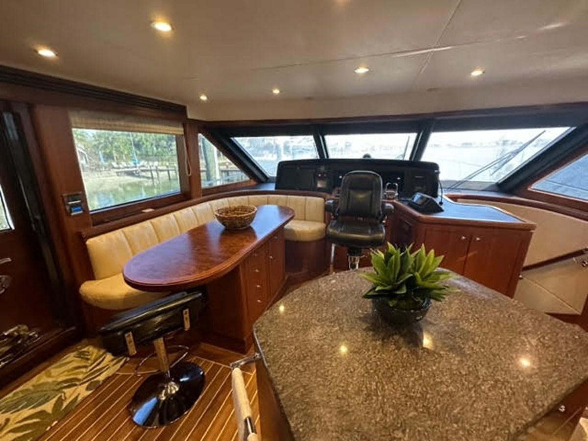 a dining room with a table and chairs aboard ISLAND GIRL Yacht for Sale
