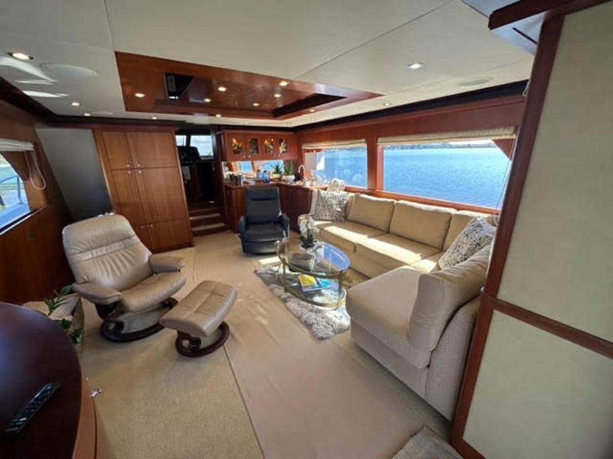 a living room with a large window aboard ISLAND GIRL Yacht for Sale