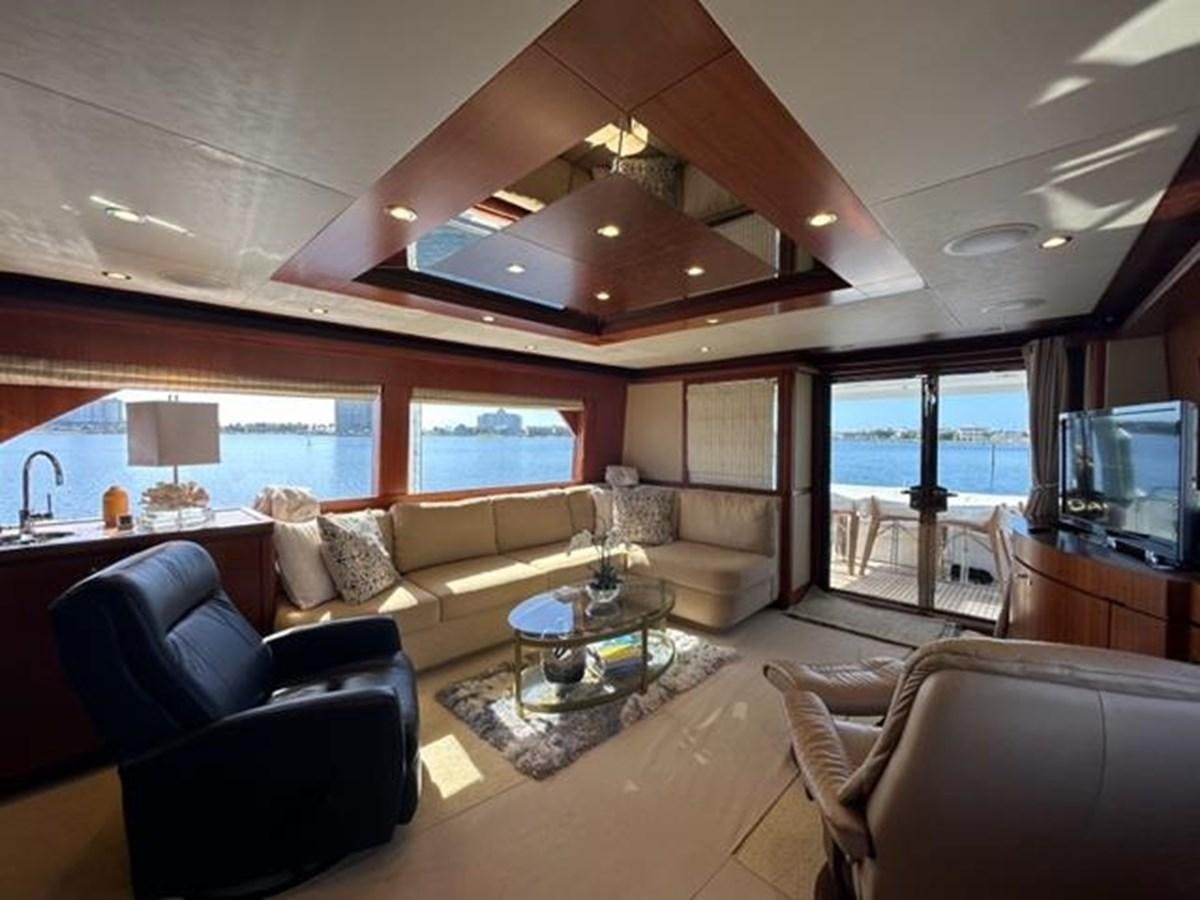 a living room with a large window aboard ISLAND GIRL Yacht for Sale