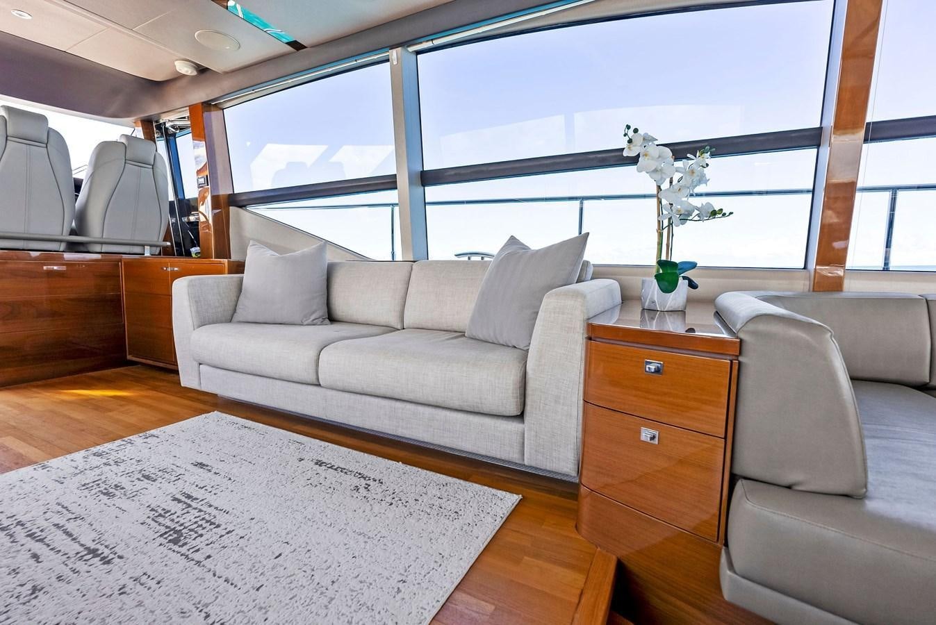 a living room with a couch and a coffee table aboard SOLIANA Yacht for Sale