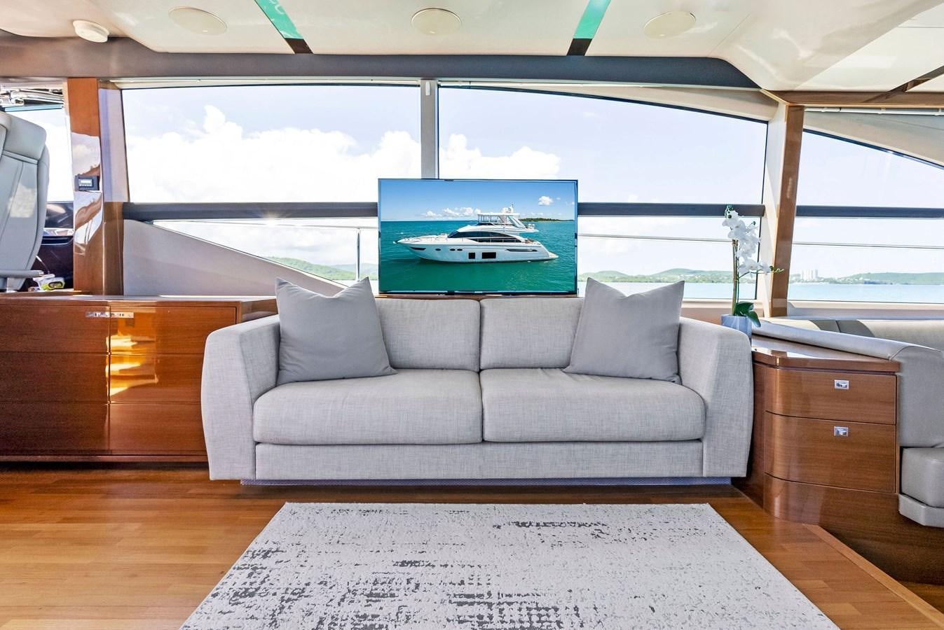 a living room with a large window aboard SOLIANA Yacht for Sale