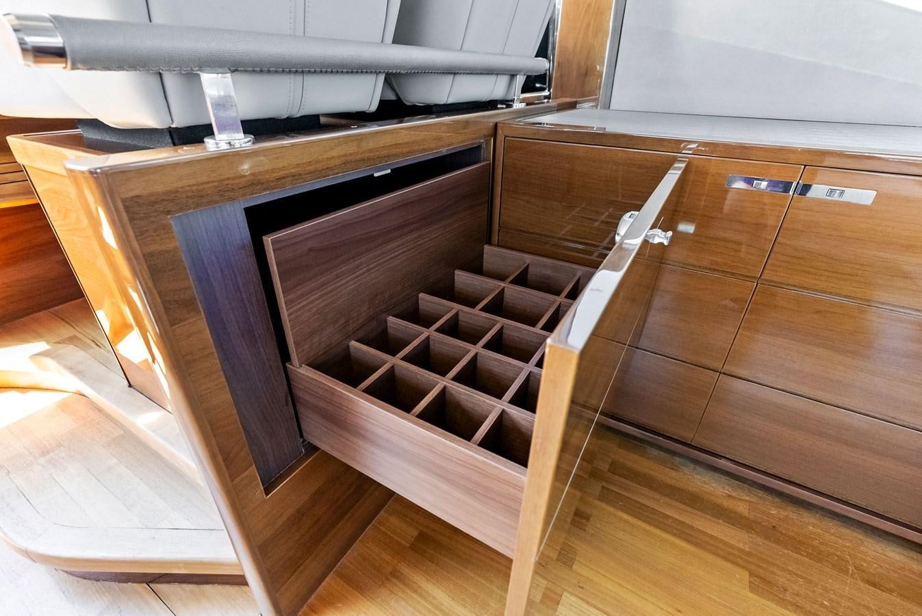 a wooden cabinet with drawers aboard SOLIANA Yacht for Sale