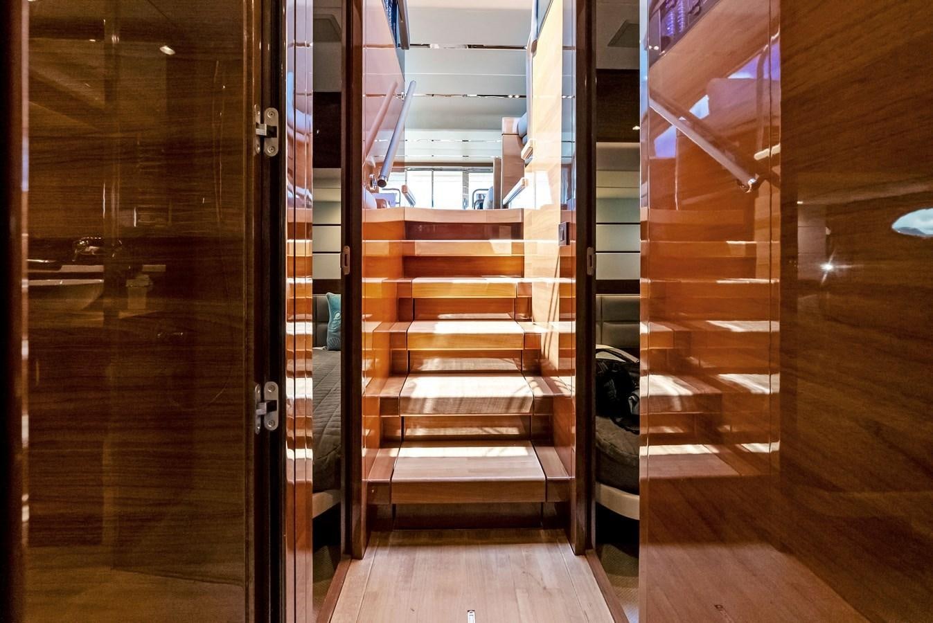 a hallway with wooden doors aboard SOLIANA Yacht for Sale