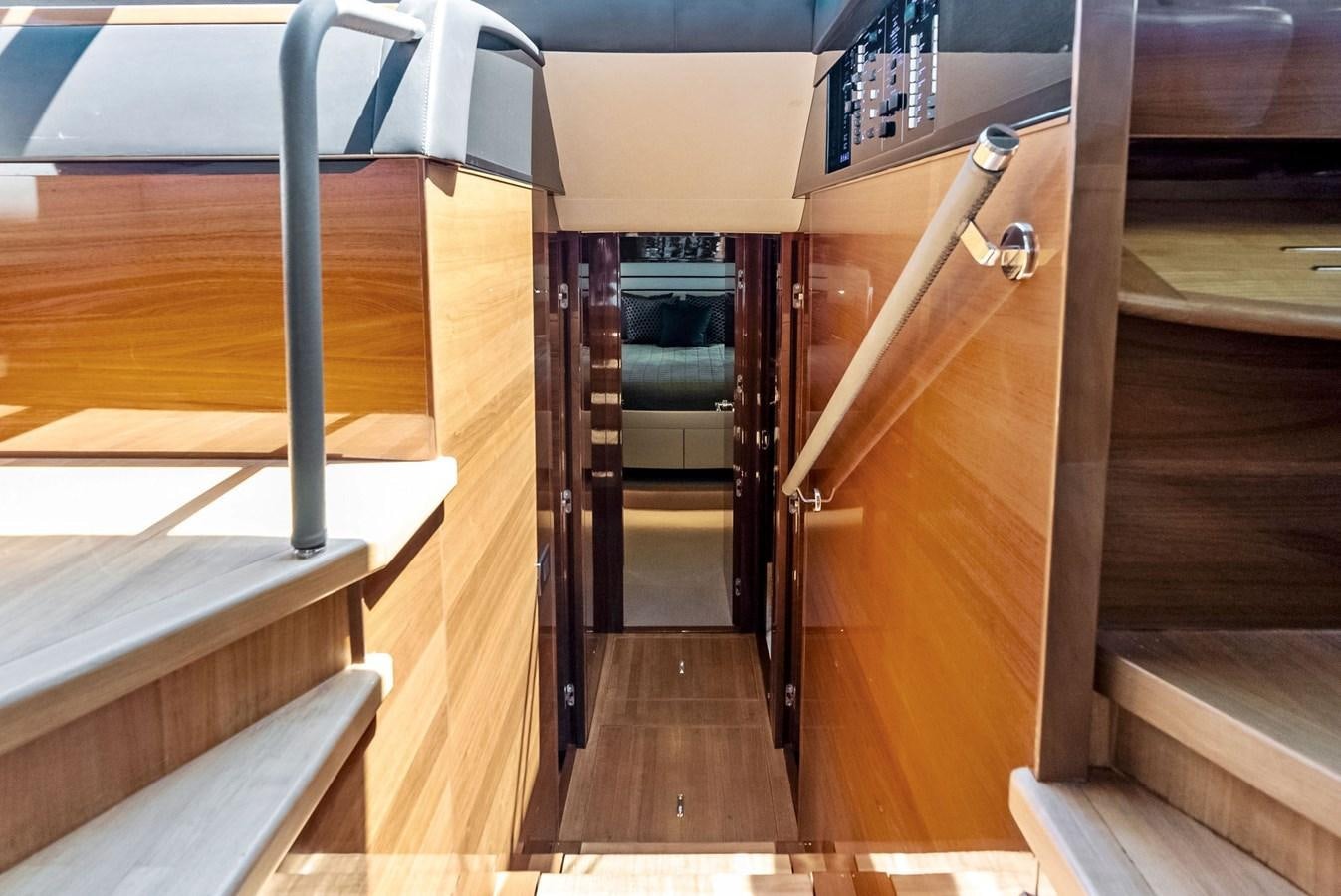 a wooden walkway with a metal railing aboard SOLIANA Yacht for Sale