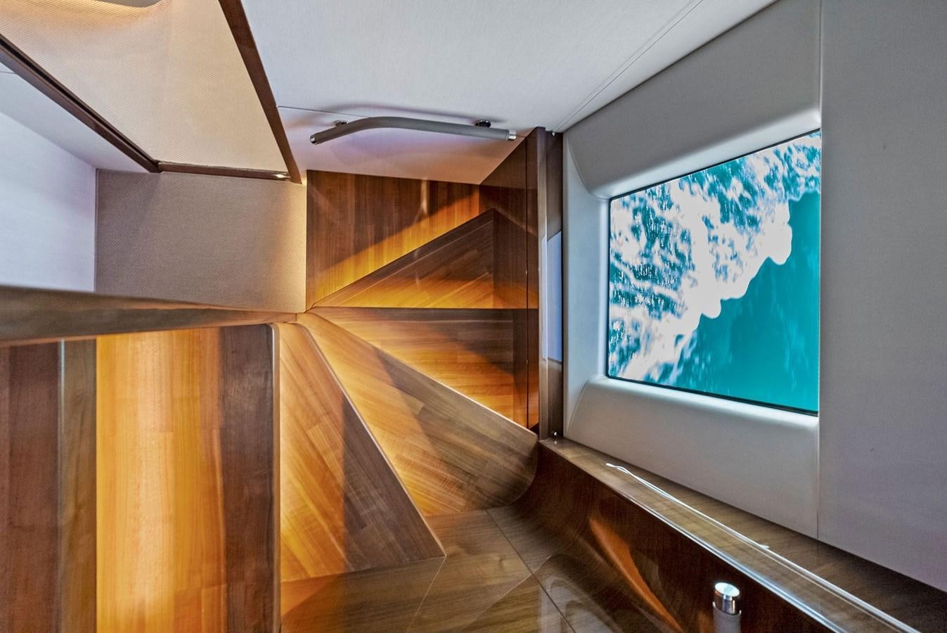 a hallway with a large screen aboard SOLIANA Yacht for Sale