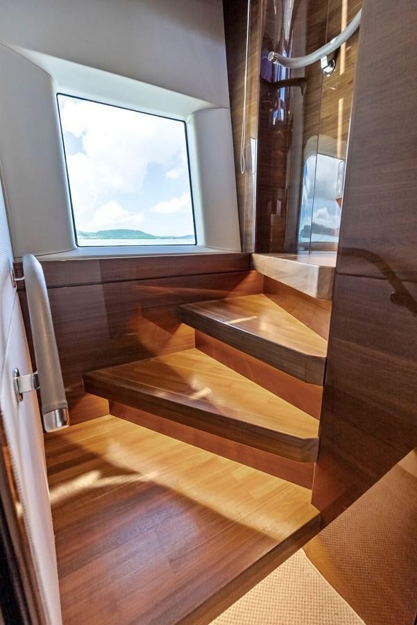 a room with wood floors and a window aboard SOLIANA Yacht for Sale
