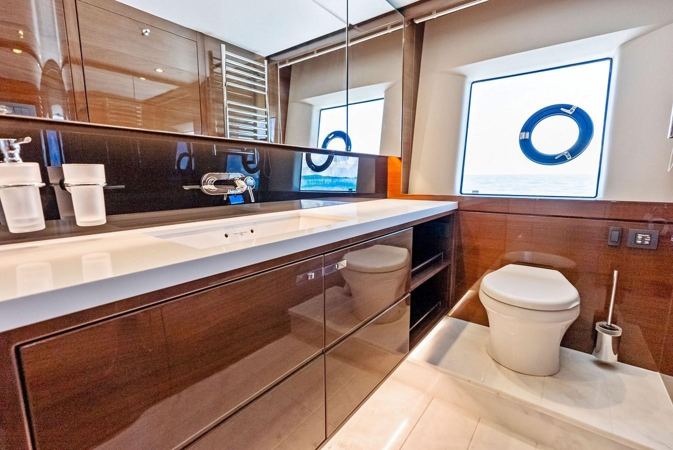 a bathroom with a toilet and a sink aboard SOLIANA Yacht for Sale