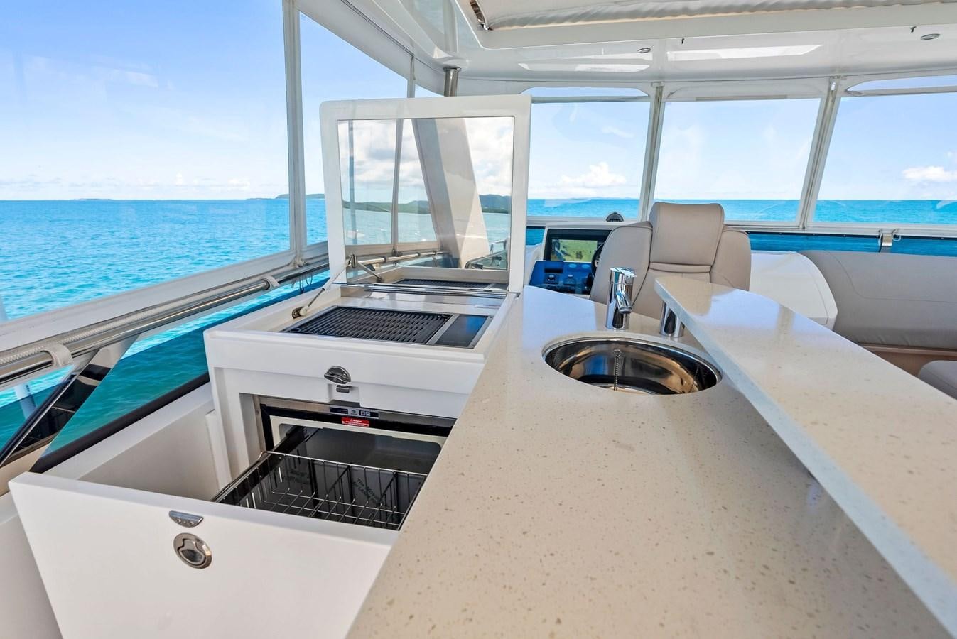 a boat with a sink and a chair on the deck aboard SOLIANA Yacht for Sale