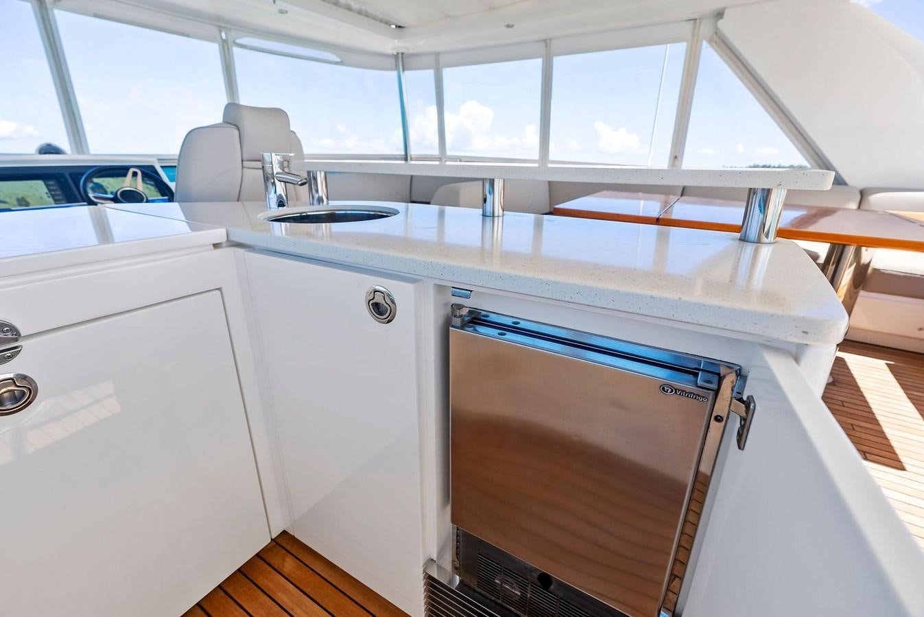a kitchen with a sink and cabinets aboard SOLIANA Yacht for Sale