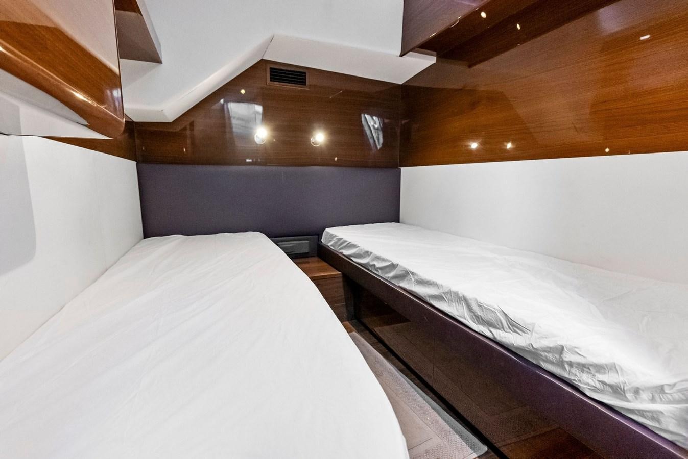 a couple of beds in a room aboard SOLIANA Yacht for Sale