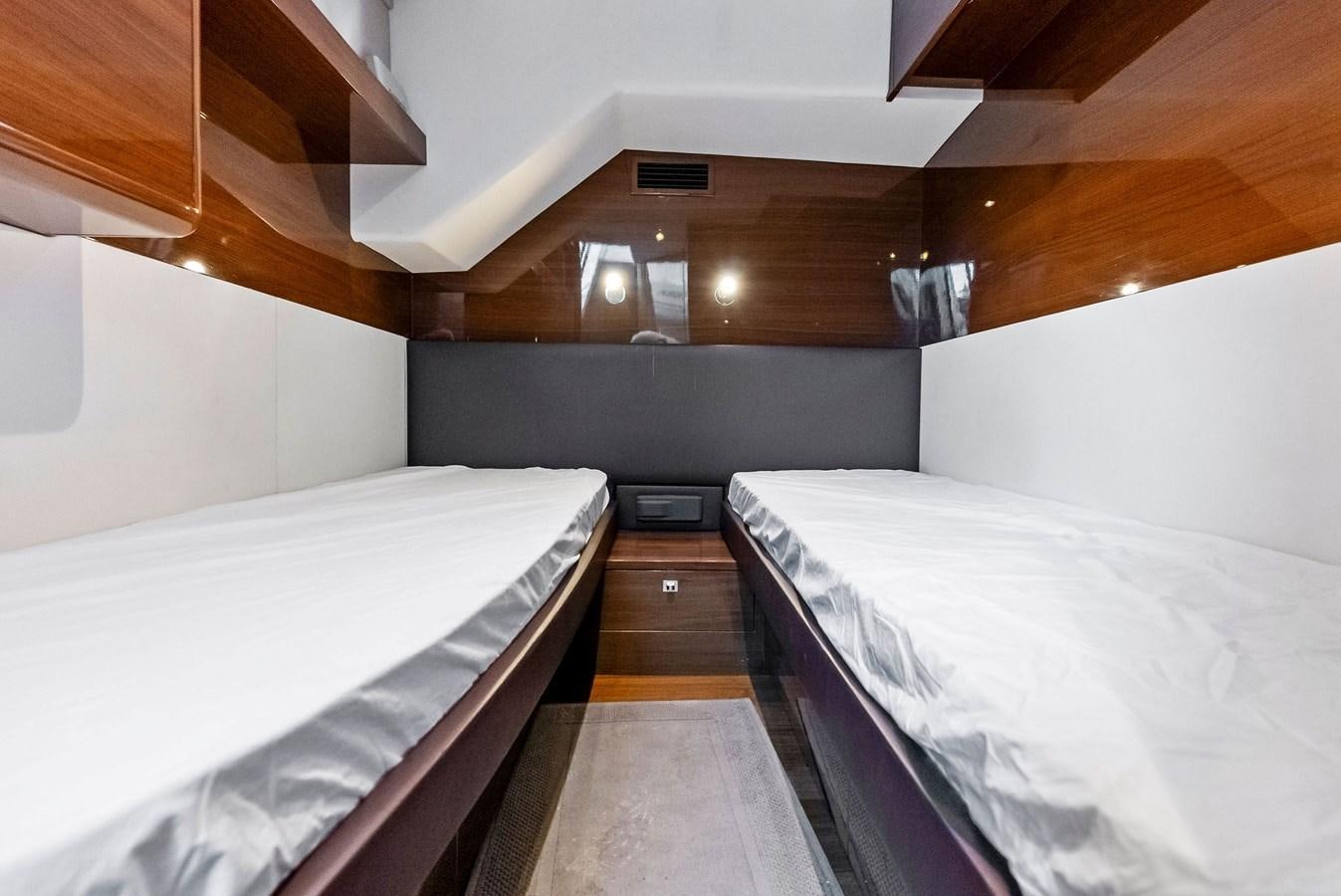 a couple of beds in a room aboard SOLIANA Yacht for Sale