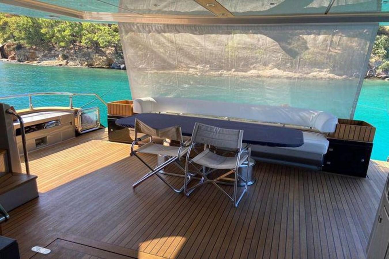 a pool table and chairs on a deck aboard RIVA 85 OPERA SUPER Yacht for Sale