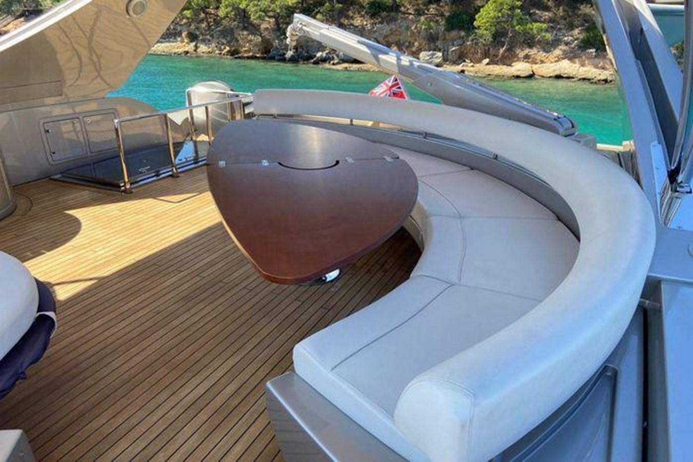 a round metal object on a wood surface aboard RIVA 85 OPERA SUPER Yacht for Sale