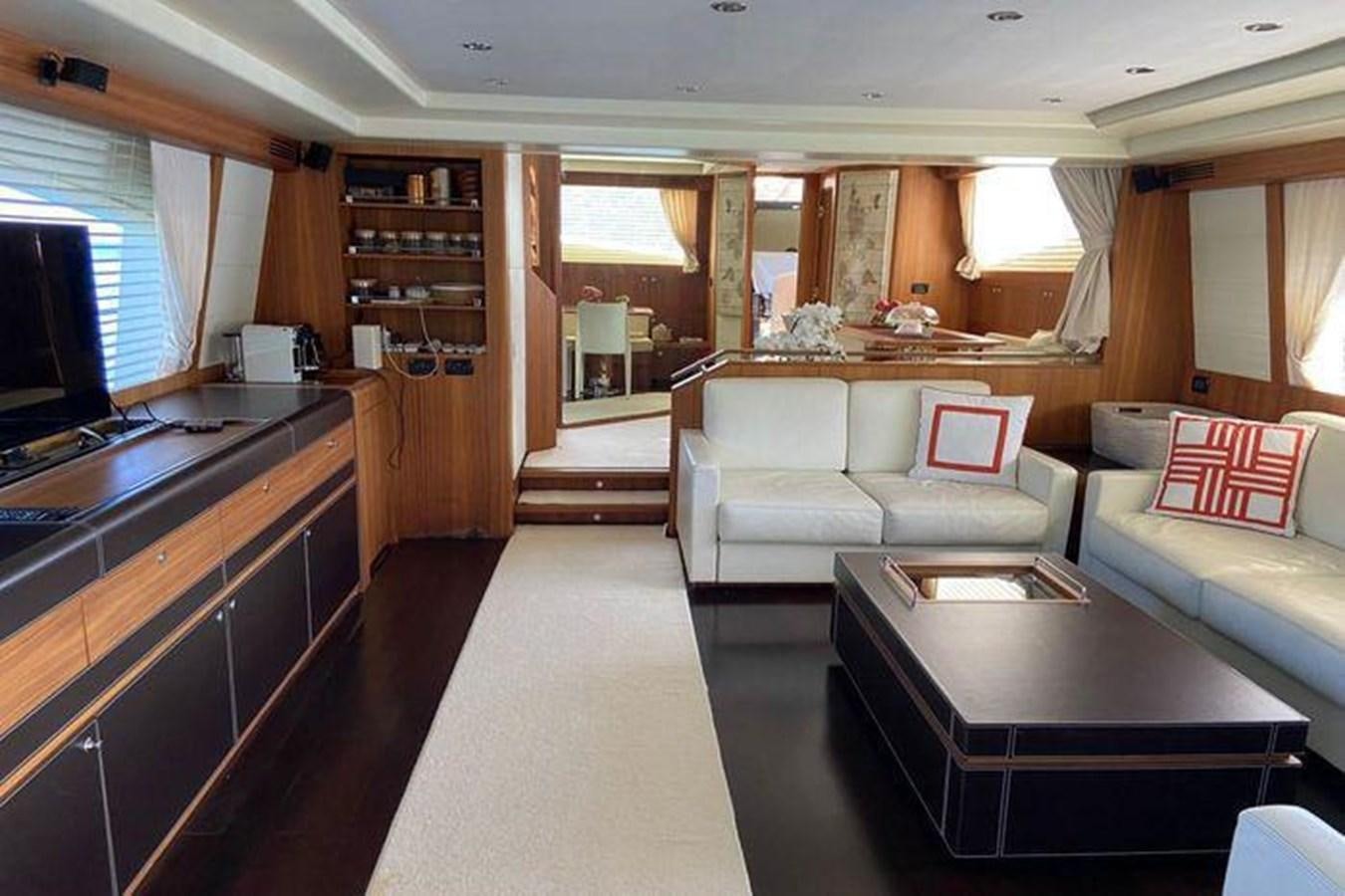 a living room with a couch and a table aboard RIVA 85 OPERA SUPER Yacht for Sale