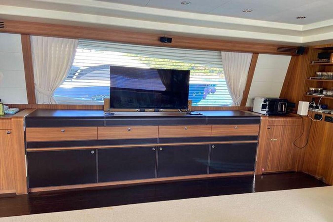 a tv on a shelf aboard RIVA 85 OPERA SUPER Yacht for Sale