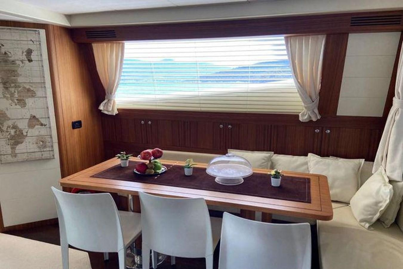 a dining table in a room aboard RIVA 85 OPERA SUPER Yacht for Sale