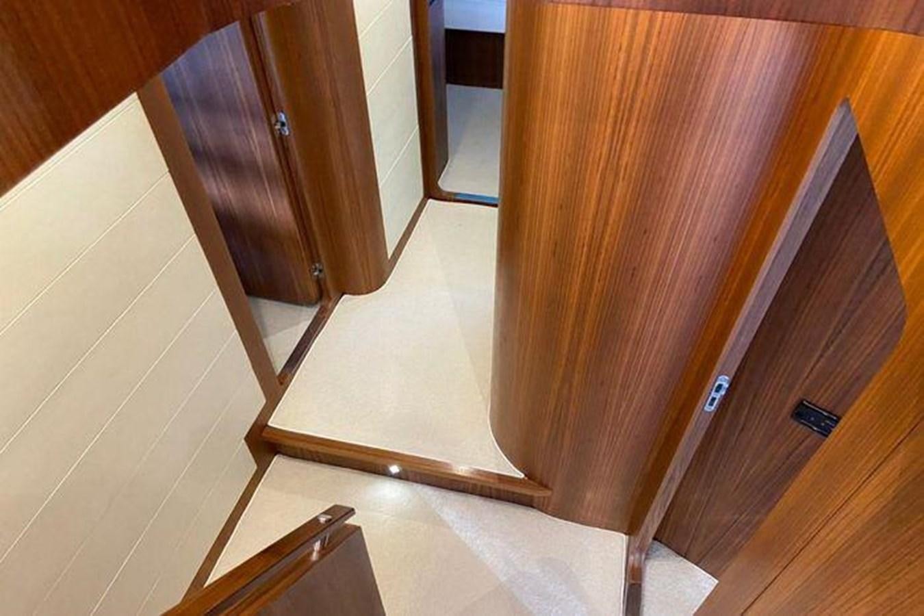 a wooden door with a white floor aboard RIVA 85 OPERA SUPER Yacht for Sale