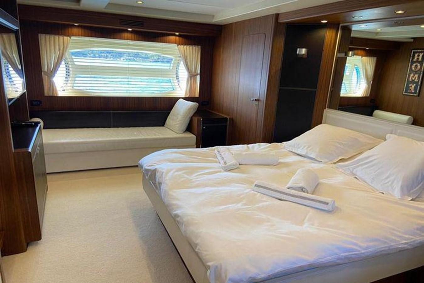 a bed with a tray on it aboard RIVA 85 OPERA SUPER Yacht for Sale