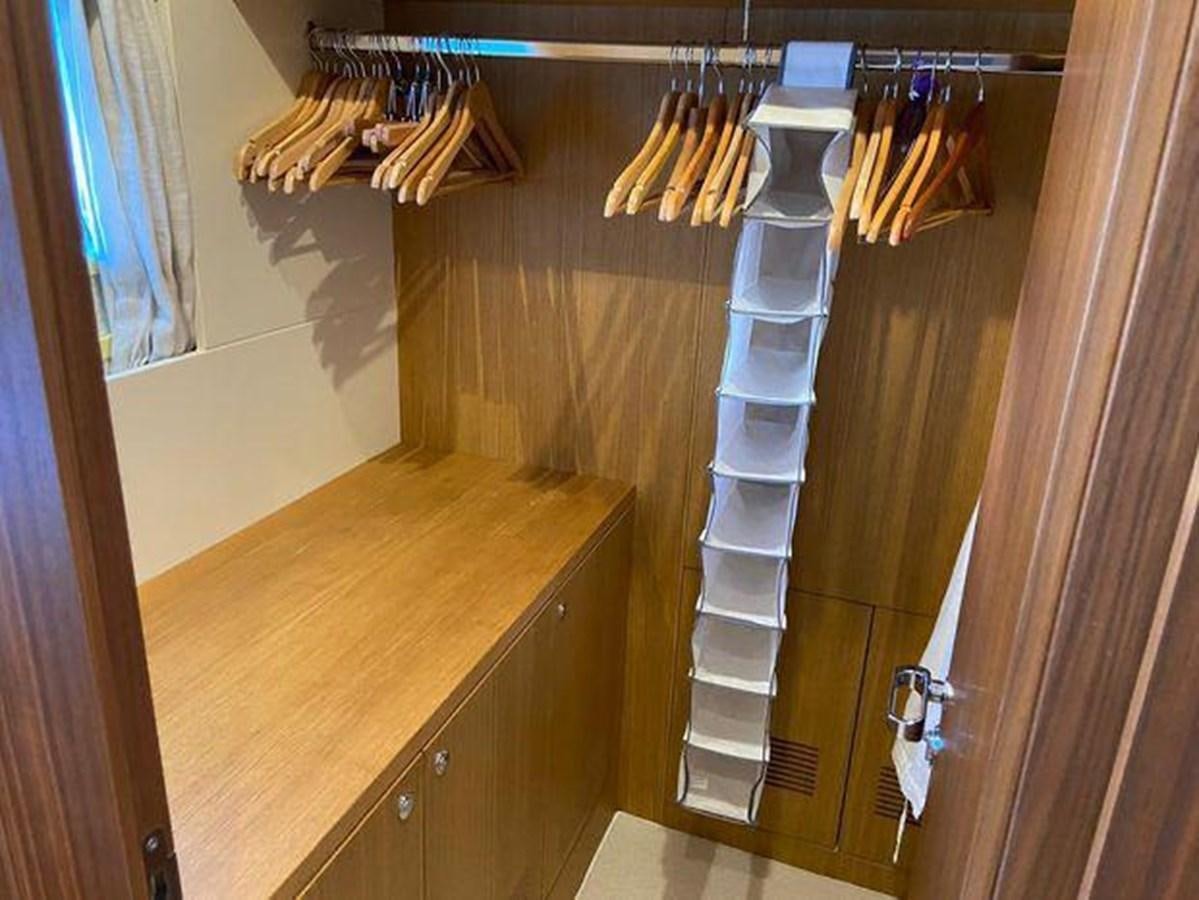 a kitchen with a wood counter and a wood cabinet aboard RIVA 85 OPERA SUPER Yacht for Sale