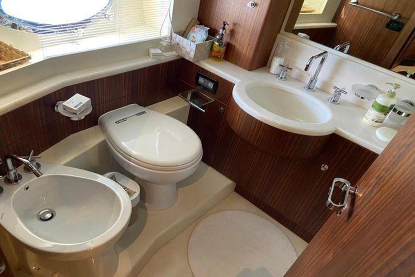 a bathroom with a sink toilet and a bathtub aboard RIVA 85 OPERA SUPER Yacht for Sale