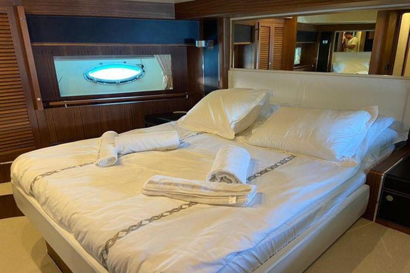 a bed with a tray on it aboard RIVA 85 OPERA SUPER Yacht for Sale