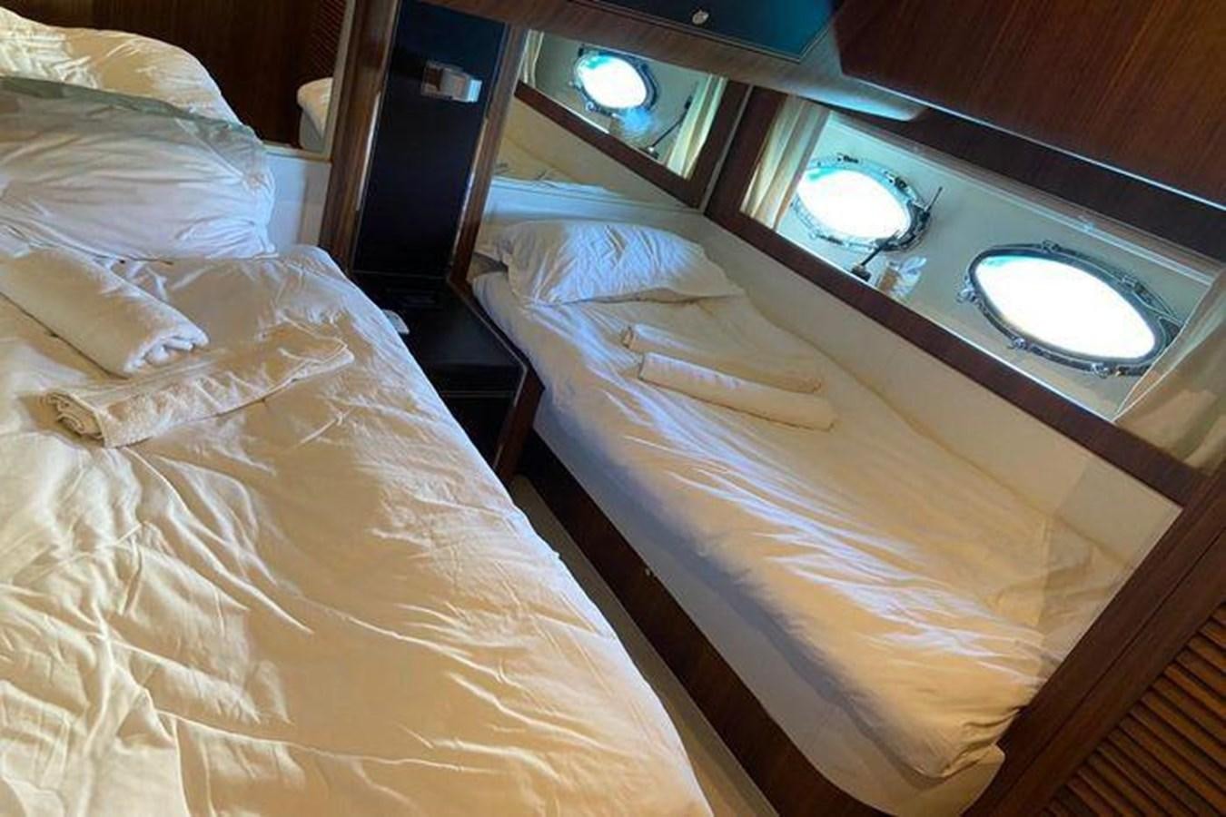 a couple of beds in a hotel room aboard RIVA 85 OPERA SUPER Yacht for Sale