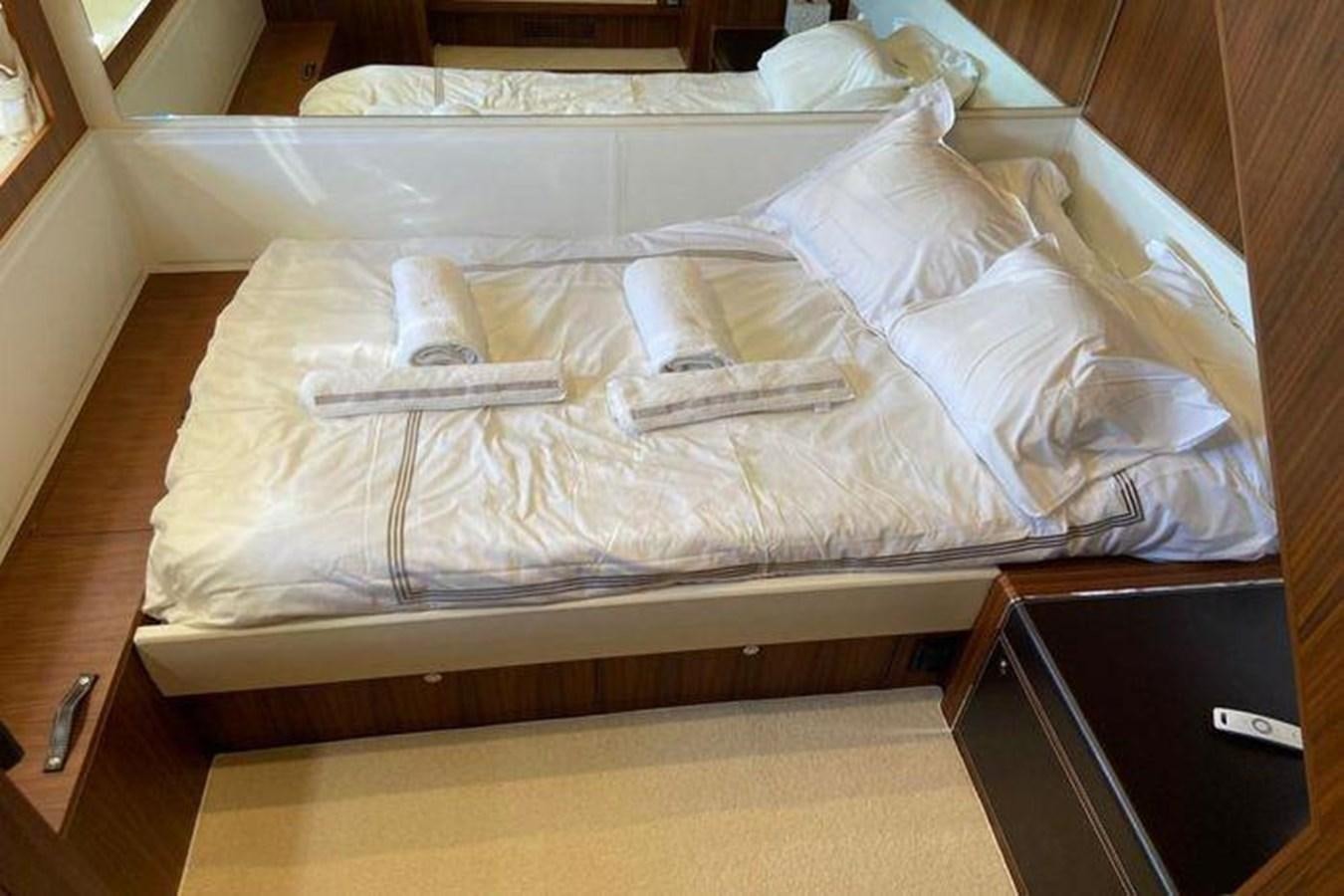 a bed with white sheets aboard RIVA 85 OPERA SUPER Yacht for Sale