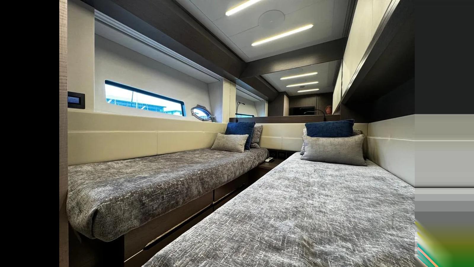 a room with a bed and a window aboard 2023 80' PERSHING 8X Yacht for Sale