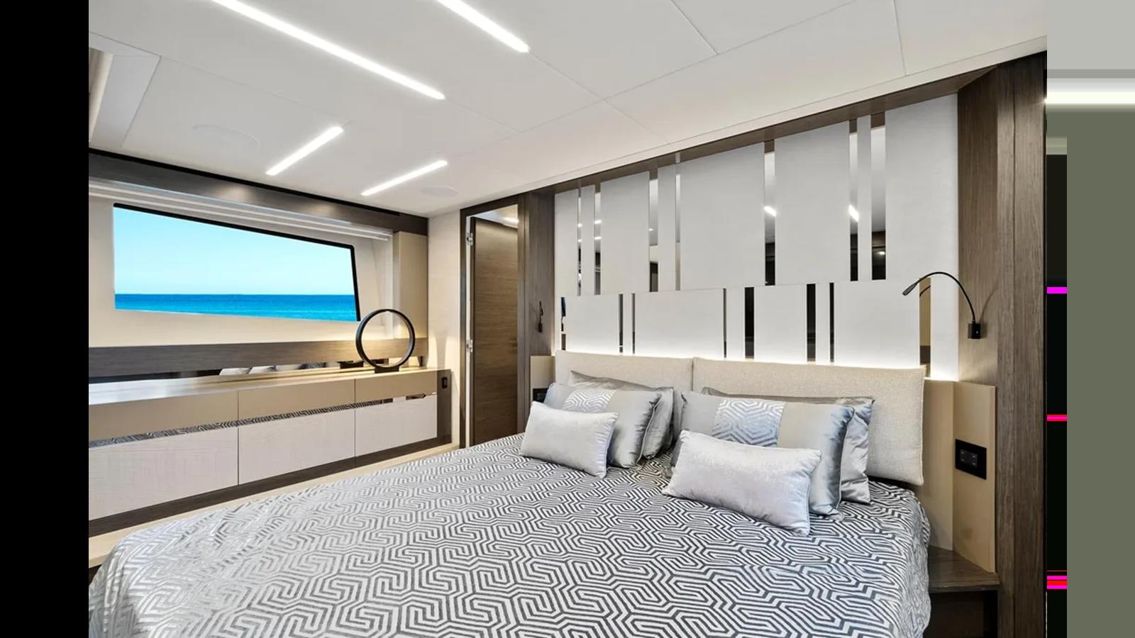 a bed with a white bed spread aboard 2023 80' PERSHING 8X Yacht for Sale