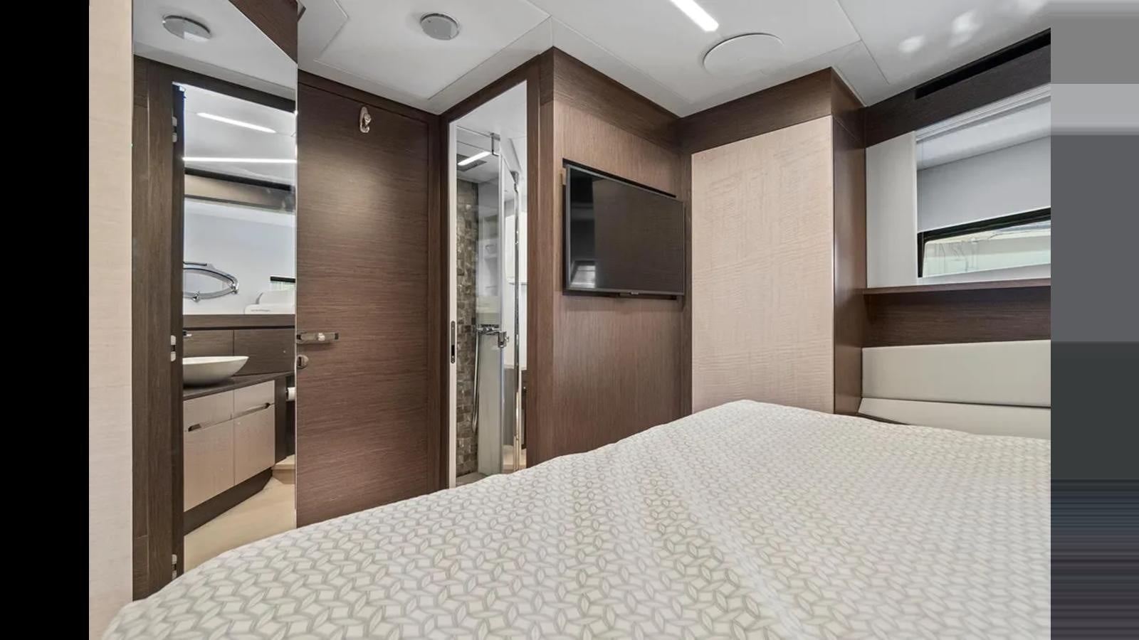 a bedroom with a bed aboard 2023 80' PERSHING 8X Yacht for Sale