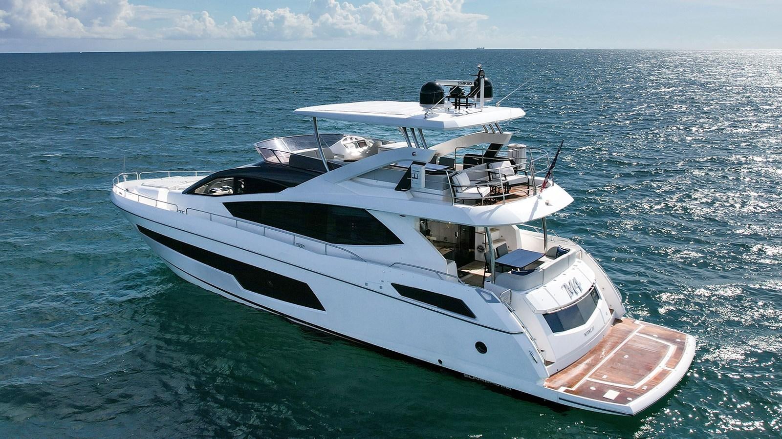 a white boat in the water aboard M4 Yacht for Sale
