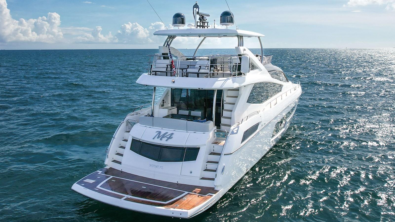 a white boat in the water aboard M4 Yacht for Sale
