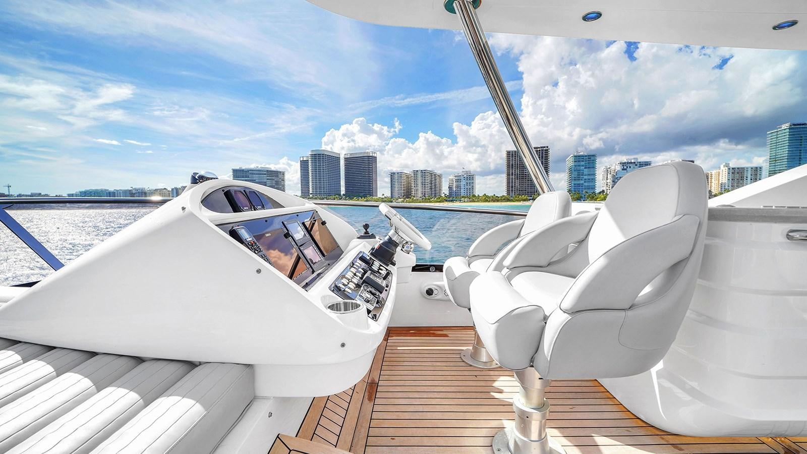 a white boat on a deck aboard M4 Yacht for Sale