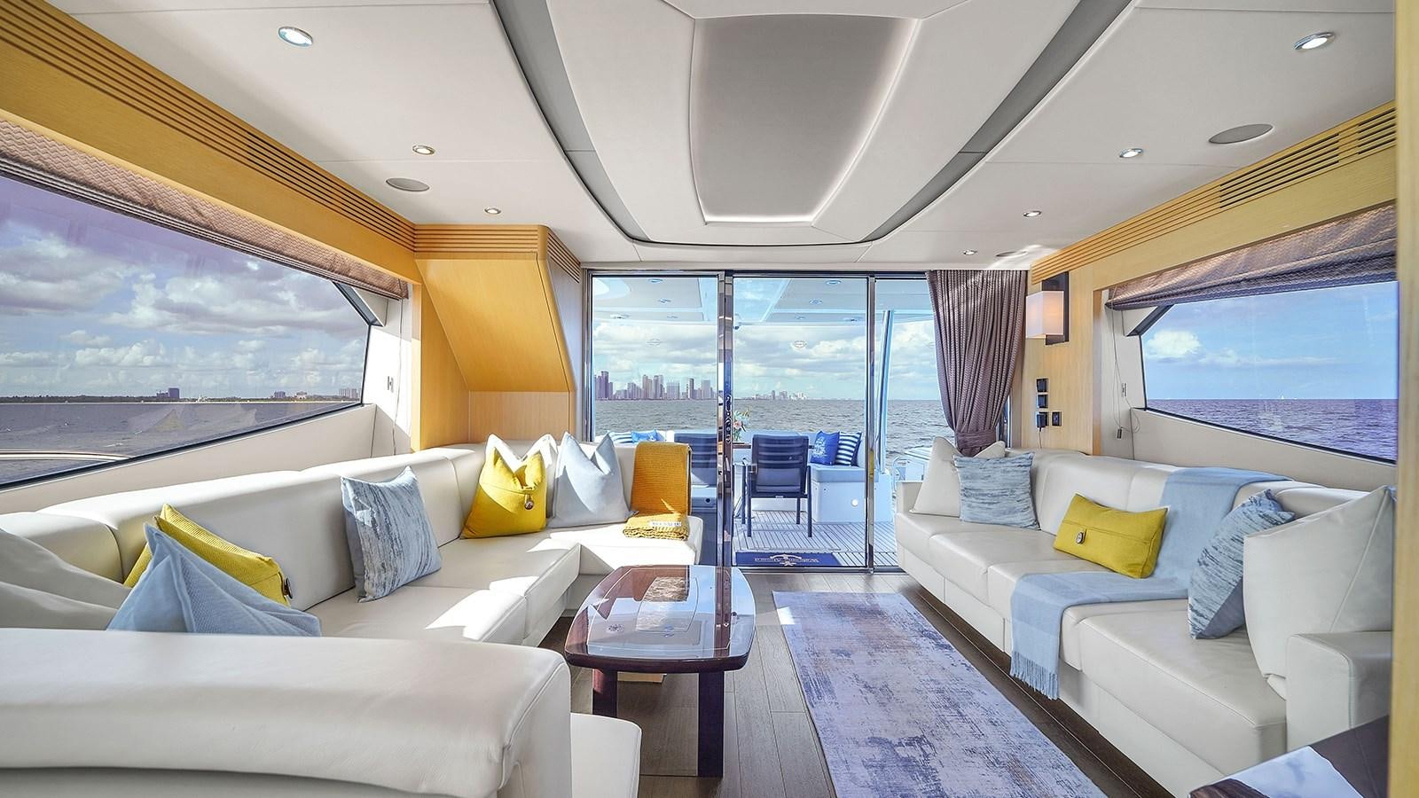 a living room with a large window aboard M4 Yacht for Sale