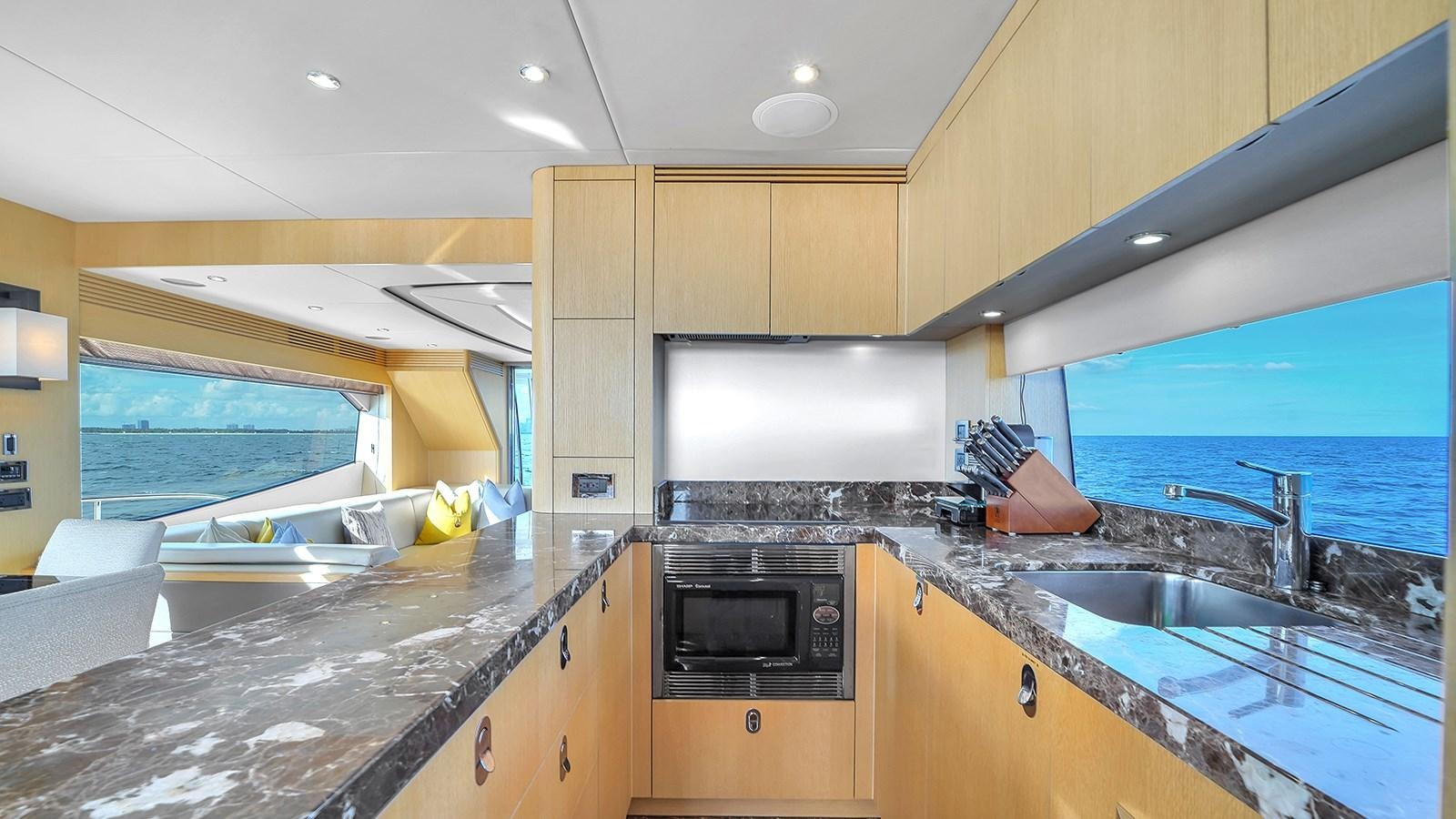 a kitchen with a large island aboard M4 Yacht for Sale