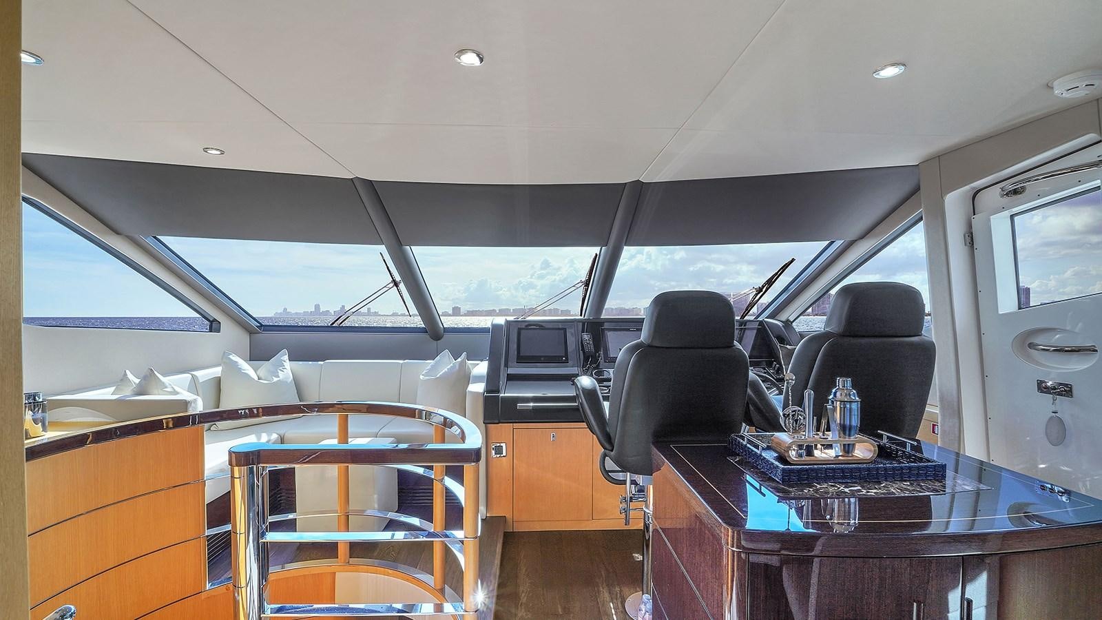 inside of a vehicle with a table and chairs aboard M4 Yacht for Sale