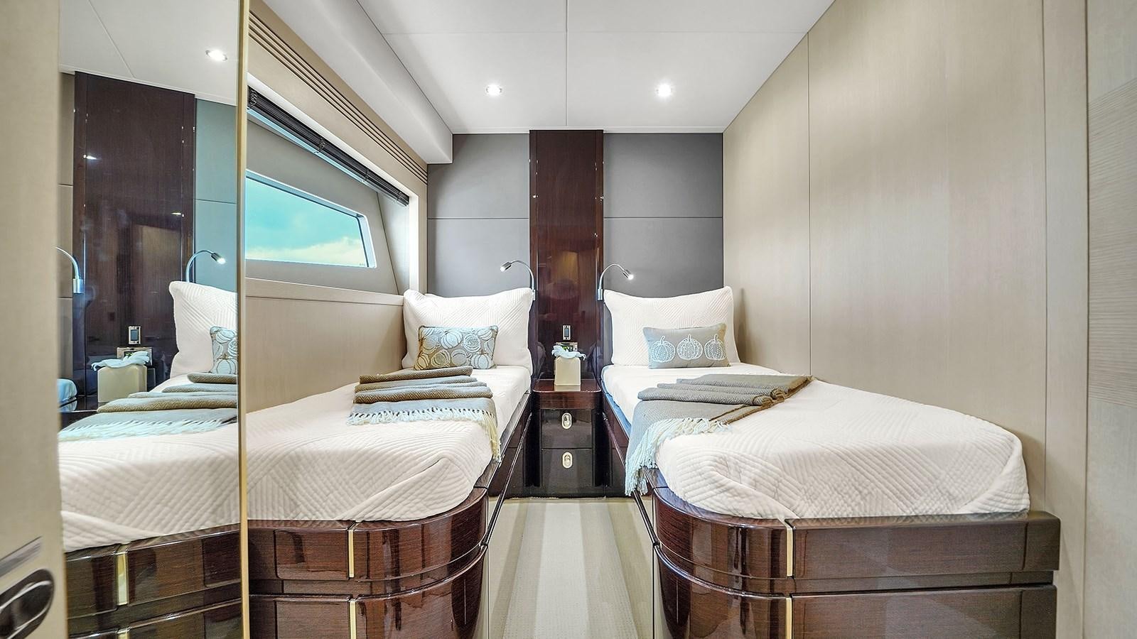 a couple of beds in a hotel room aboard M4 Yacht for Sale