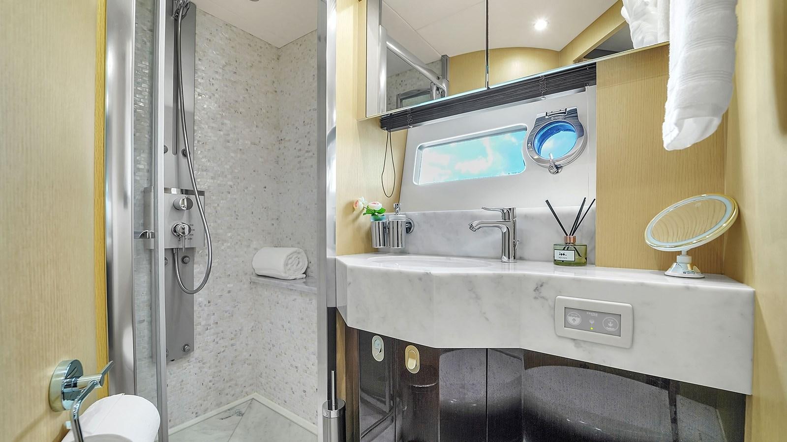 a bathroom with a sink and a mirror aboard M4 Yacht for Sale