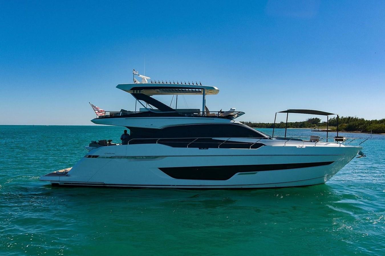 a white boat on the water aboard 2021 FAIRLINE SQUADRON 68 Yacht for Sale