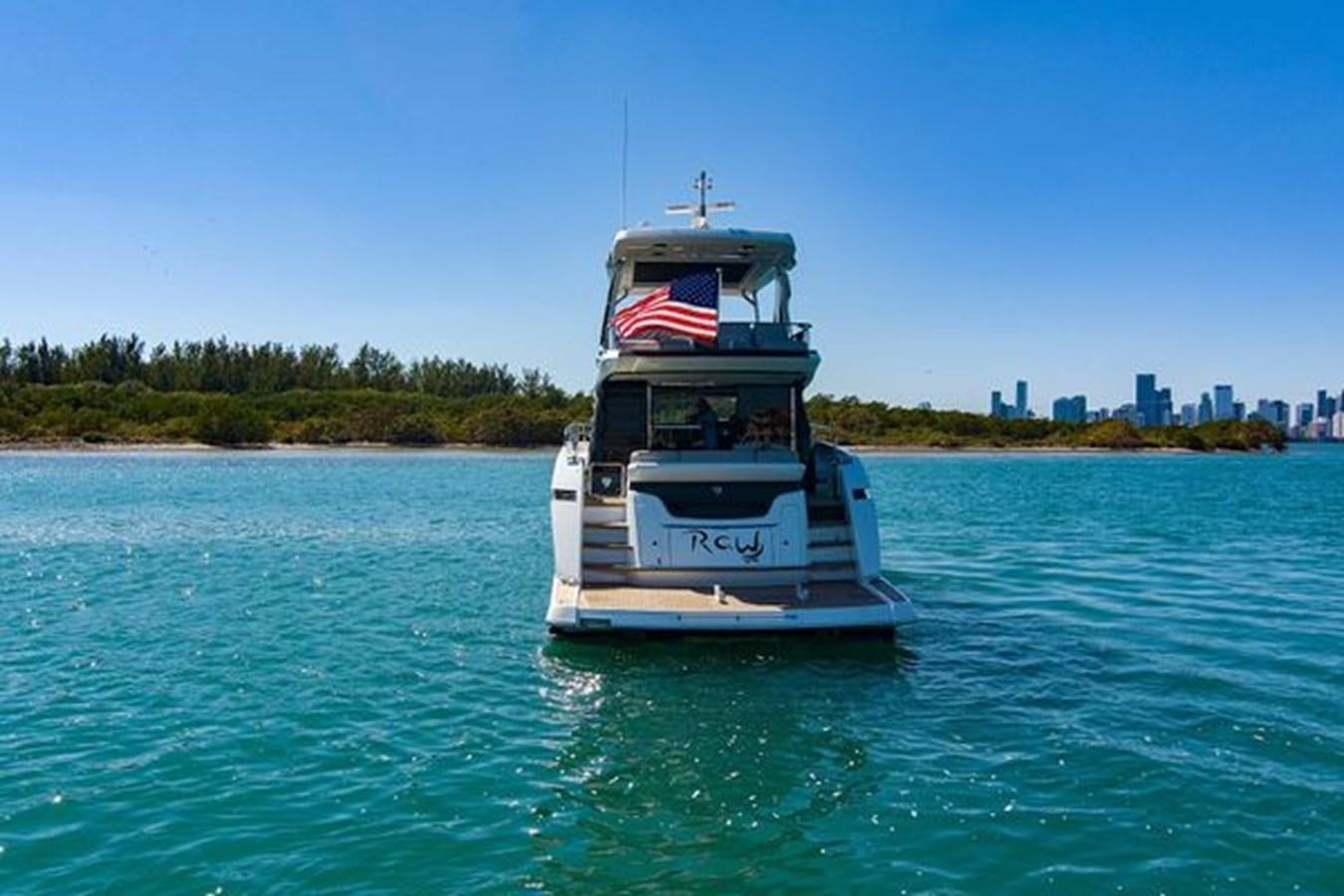 a boat on the water aboard 2021 FAIRLINE SQUADRON 68 Yacht for Sale