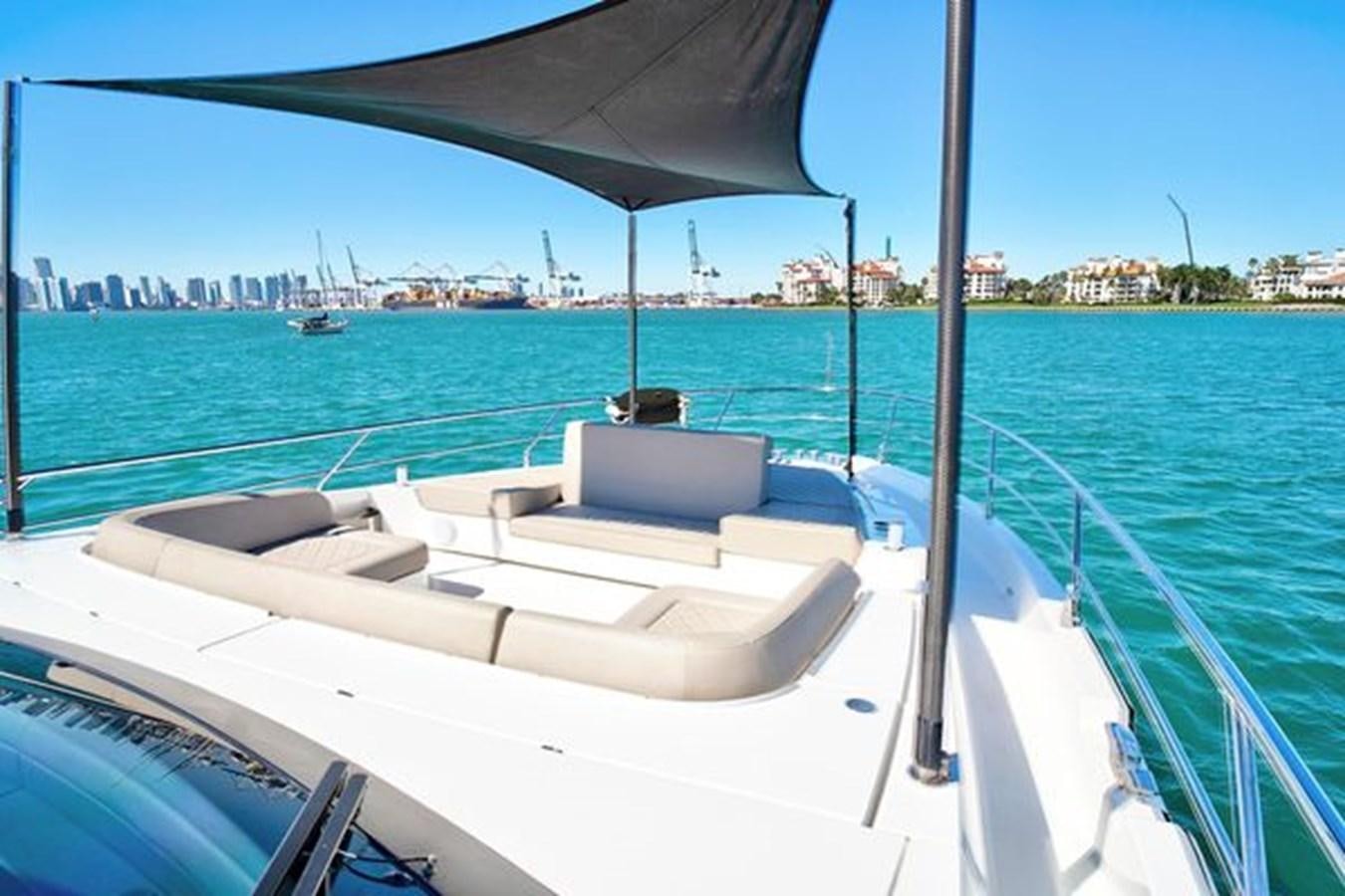 a boat on the water aboard 2021 FAIRLINE SQUADRON 68 Yacht for Sale