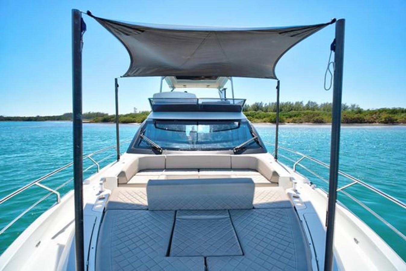 a boat on the water aboard 2021 FAIRLINE SQUADRON 68 Yacht for Sale
