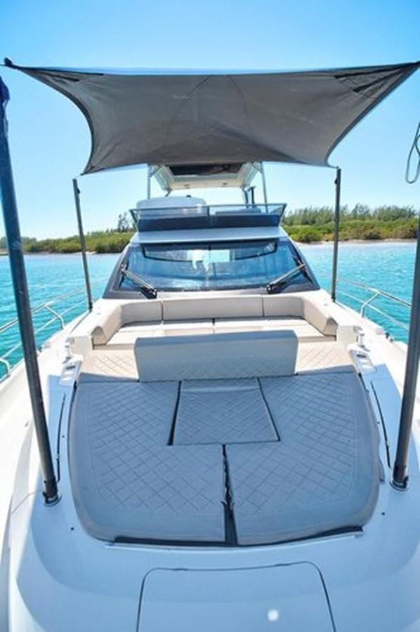 a boat on the water aboard 2021 FAIRLINE SQUADRON 68 Yacht for Sale