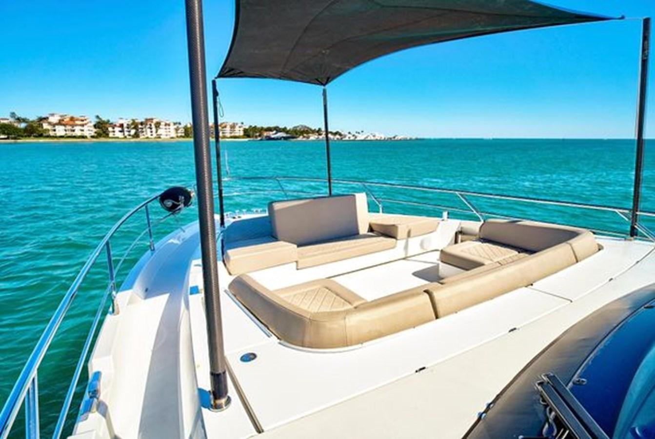 a boat on the water aboard 2021 FAIRLINE SQUADRON 68 Yacht for Sale