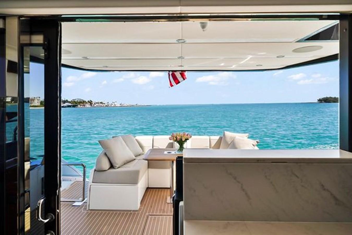 a room with a view of the ocean and a beach aboard 2021 FAIRLINE SQUADRON 68 Yacht for Sale