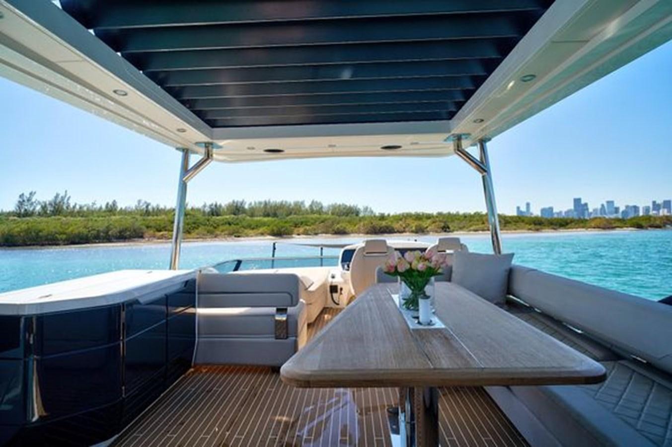 a table on a boat aboard 2021 FAIRLINE SQUADRON 68 Yacht for Sale