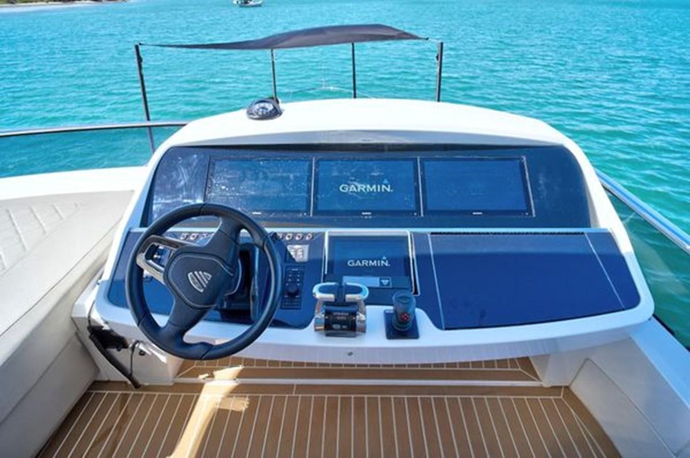 a boat on the water aboard 2021 FAIRLINE SQUADRON 68 Yacht for Sale