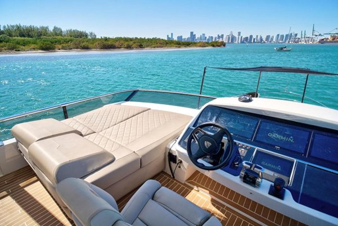 a boat on the water aboard 2021 FAIRLINE SQUADRON 68 Yacht for Sale